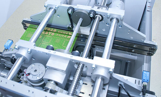 Handling machine, interior view of a turning station with printed circuit board.