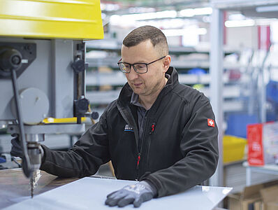 A man is working on a machine.