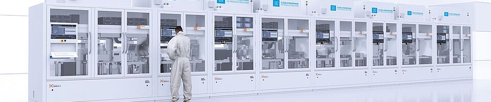 Cleanroom cabin line with a man in laboratory clothing standing in front of it.
