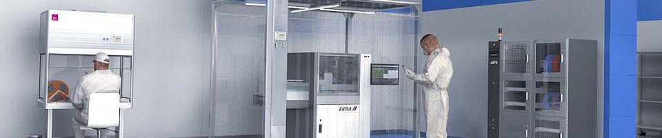 Cleanroom with blue stripes on the wall and floor. In the center is a machine inside a cleanroom cabin. On the right is a dry storage cabinet. One man is seated at a clean workstation, another stands in front of the cleanroom cabin.
