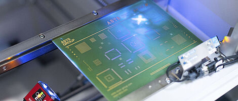 Interior view of a laser scanning machine, laser on a printed circuit board.