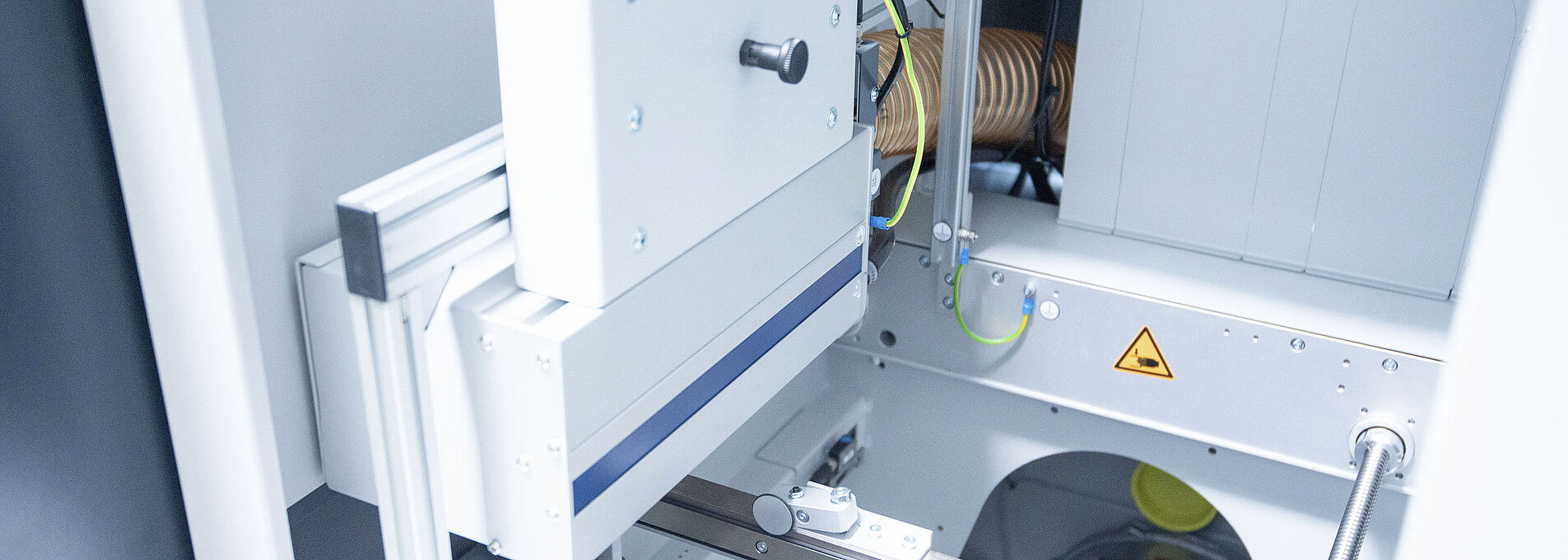 Interior view of a handling cleaning station with visible components.