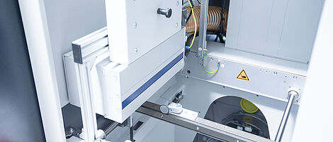 Interior view of a handling cleaning station with visible components.
