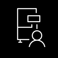 White pictogram of a machine with a person in front of it on black background.