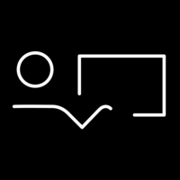 White pictogram of a stylized person in front of a rectangular object with a V-shaped line below on black background.