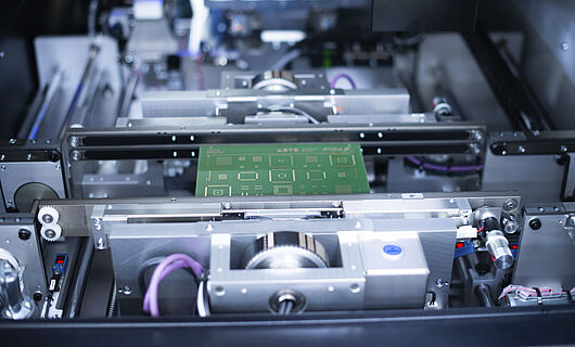 Interior view of a laser marking machine, turntable with circuit board.