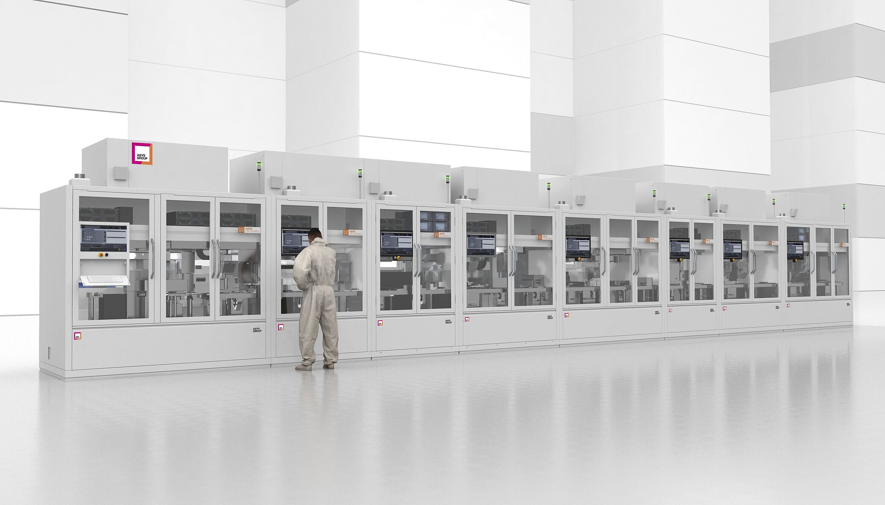 Front view of Life Sciene Final Assembly line. A man stands at a machine