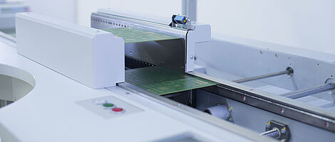 Close-up of a handling repair workstation with two PCBs.