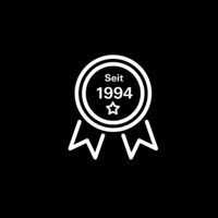 White pictogram of a medal labeled “Since 1994” on black background.