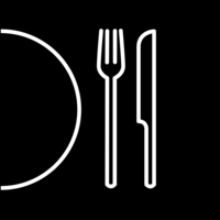 White pictogram of a half-cut plate next to a fork and knife on black background.