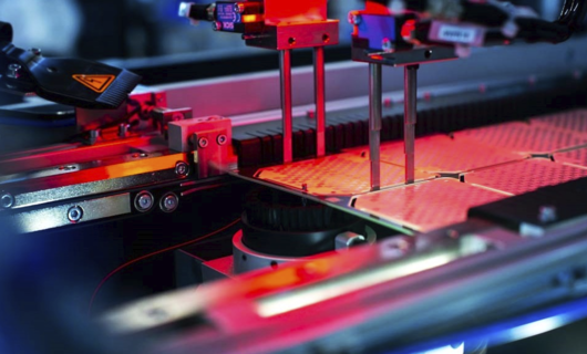 Interior view of an depaneling machine with red light.
