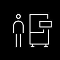 White pictogram of a person next to a machine on a black background.