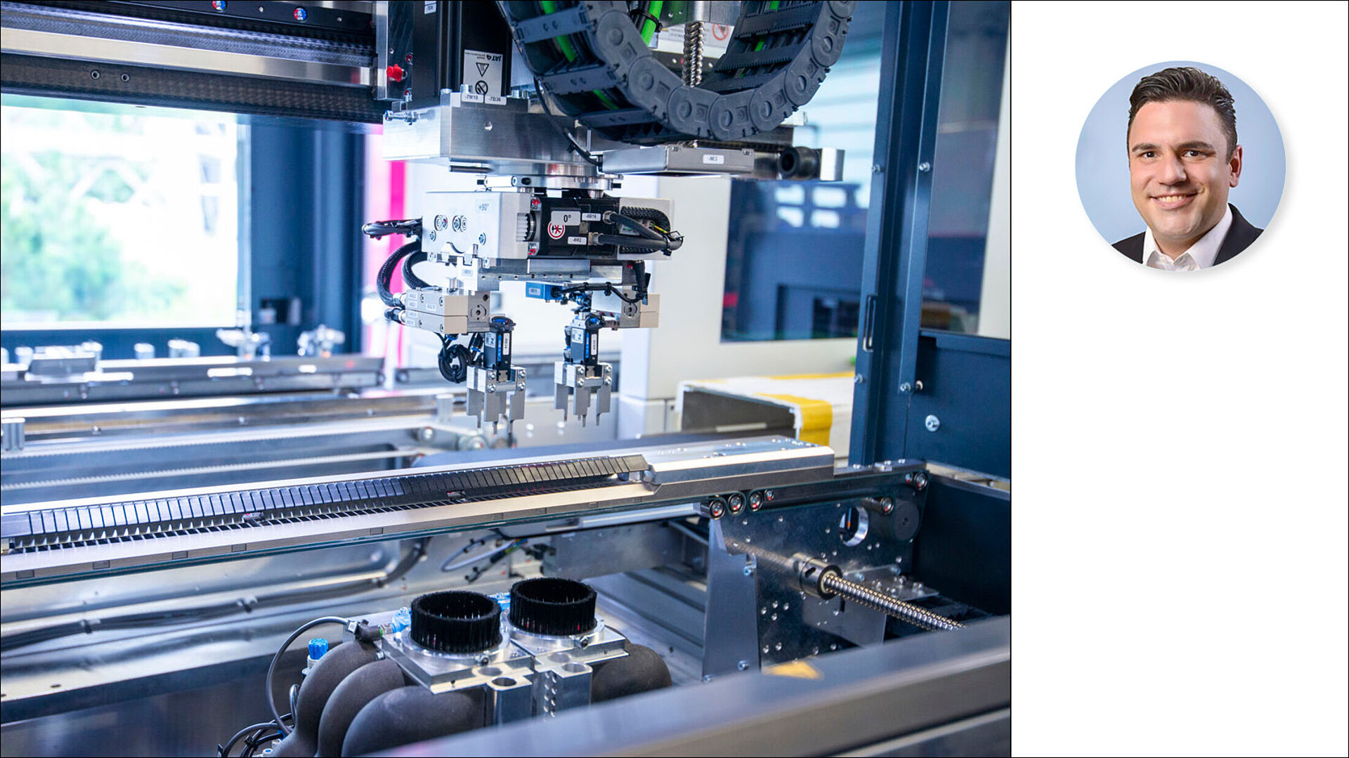 Interior view of a dual-spindle depaneling machine. Photo of a person next to it.