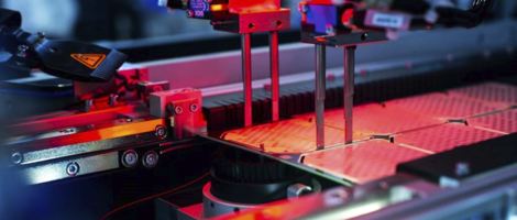 Interior view of an depaneling machine with red light.