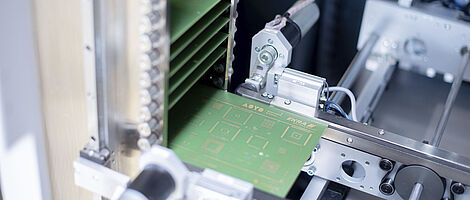 Interior view of a buffer handling machine with multiple circuit boards.