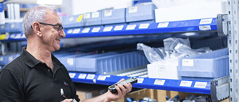 Man taking inventory in the warehouse
