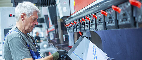 Man working on a press brake.