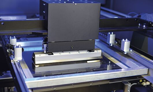 Interior view of a printing press. Squeegee.