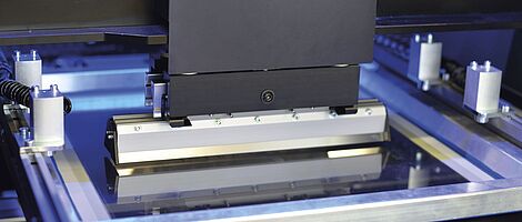 Interior view of a printing press. Squeegee.