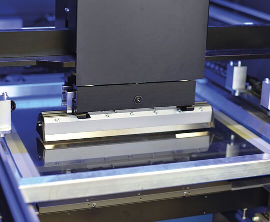 Interior view of a printing press. Squeegee.