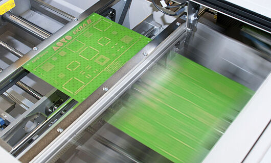 Interior view of a handling machine with an inserted circuit board.