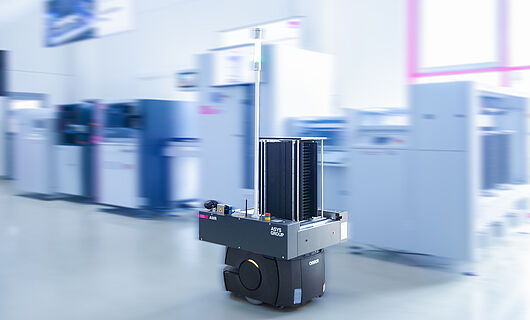 AMR in a demo room in front of a machine line.