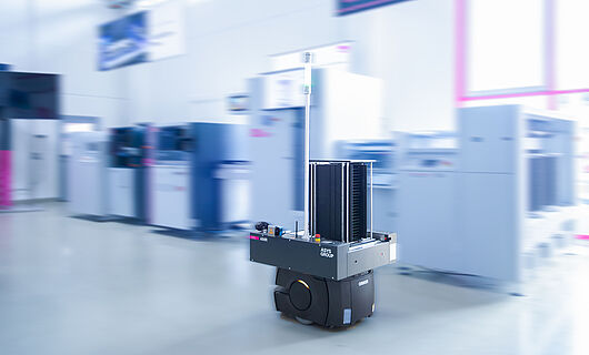 AMR in a demo room in front of a machine line.