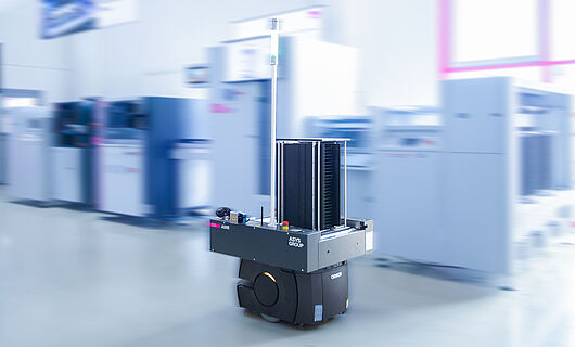 AMR in a demo room in front of a machine line.