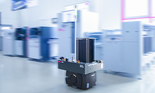 AMR in a demo room in front of a machine line.