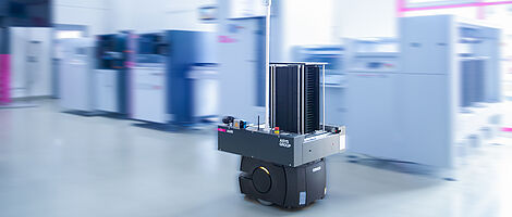 AMR in a demo room in front of a machine line.