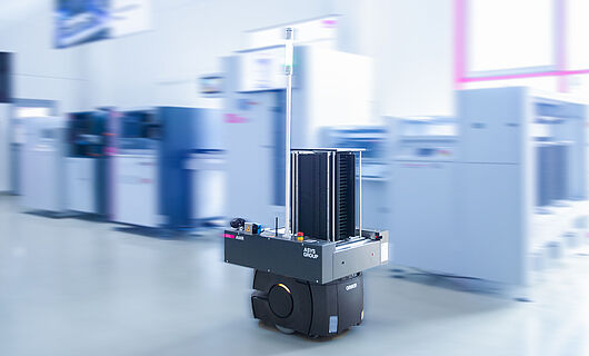 AMR in a demo room in front of a machine line.