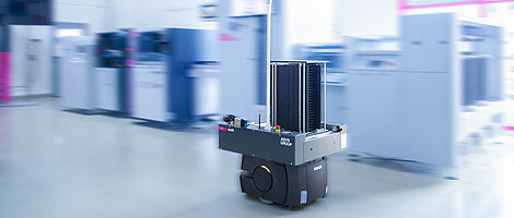 AMR in a demo room in front of a machine line.