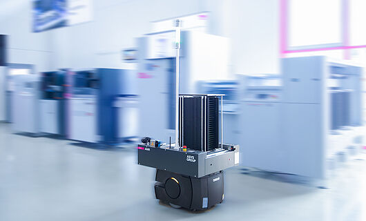 AMR in a demo room in front of a machine line.