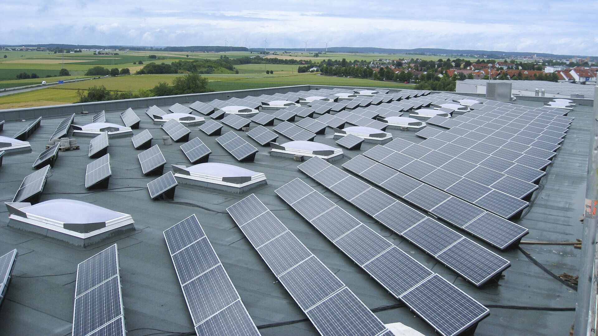 Top view shows a roof with solar panels.