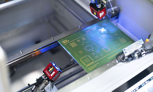 Interior view of a laser scanning machine, laser on a printed circuit board.
