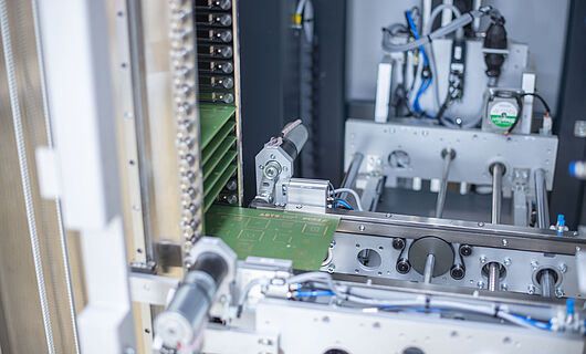 Interior view of a buffer handling machine with multiple circuit boards.