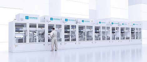 Cleanroom cabin line with a man in laboratory clothing standing in front of it.
