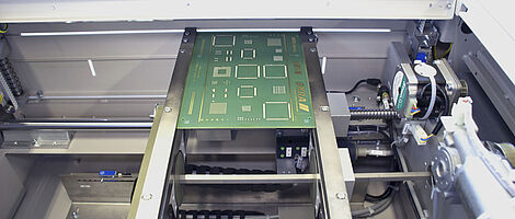 Interior view of a handling shuttle module with an inserted circuit board.